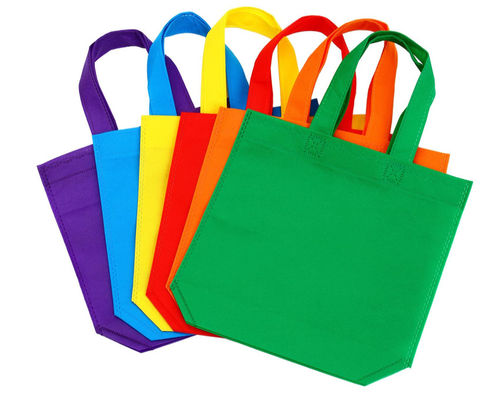 Sacos favoritos de festas não tecidos Sacos coloridos reutilizáveis Sacos não tecidos de cor sólida Sacos reutilizáveis de tote a granel com alças Sacos de mercearia não tecidos reutilizáveis